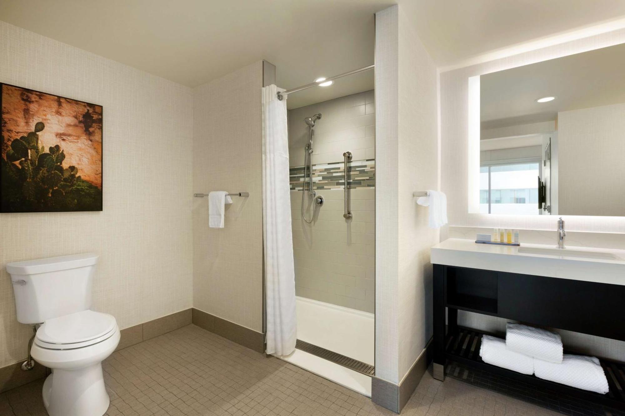 Two-Room King Suite Mobility or Hearing Accessible Roll Shower